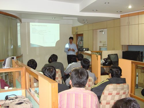 Instructional presentation in an office setting.