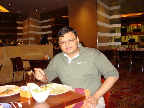 Man eating in a restaurant.